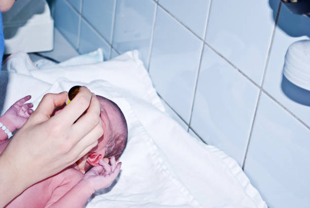 istock New-born baby undergoing first medical examination 1088492710