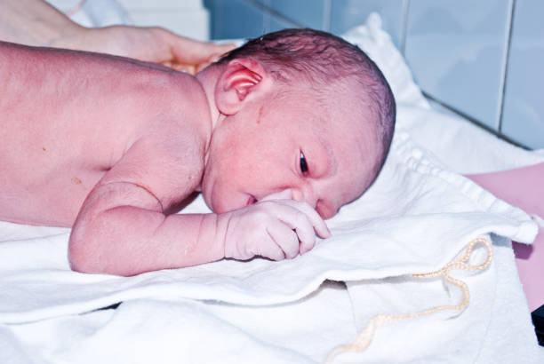 istock New-born baby undergoing first medical examination 1088493964