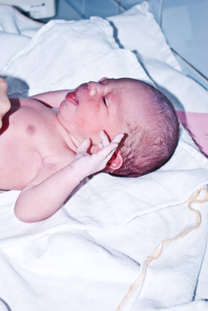 istock New-born baby undergoing first medical examination 1088495198