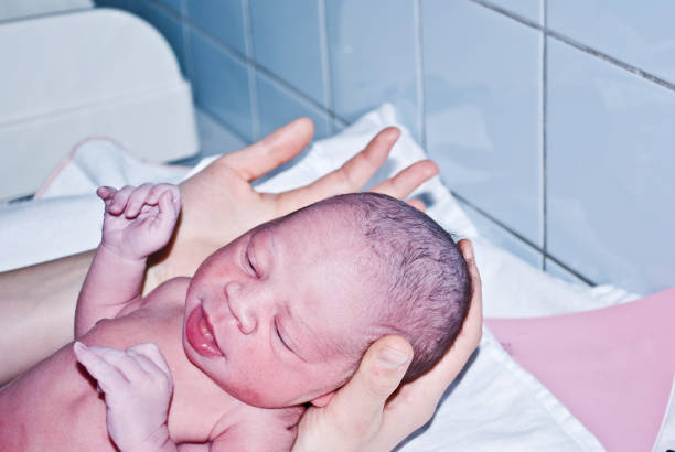 istock New-born baby undergoing first medical examination 1088495484