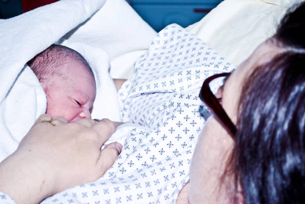 istock First Meal - New-born baby drinking breastmilk 1088498010