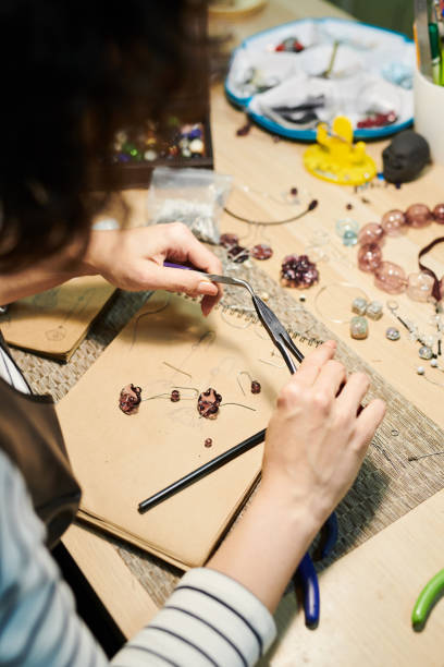 istock Woman Creating Glass Jewelry 1088505538