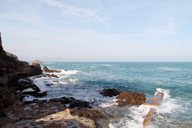 istock Beautiful coastline with waves and blue sky. 1088506092