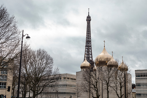 Paris, France - January 28, 2018: Street view of the Russian Orthodox church and spiritual centre And Eiffel Tower in the city of Paris, France.