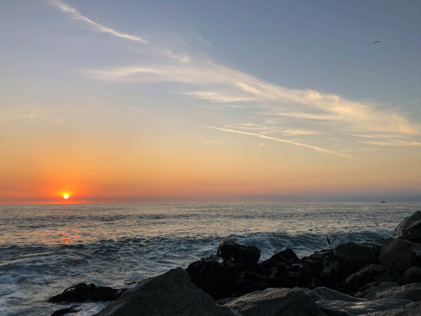 istock Waves crash on the rocks in Venice Beach, CA at sunset 1088510980