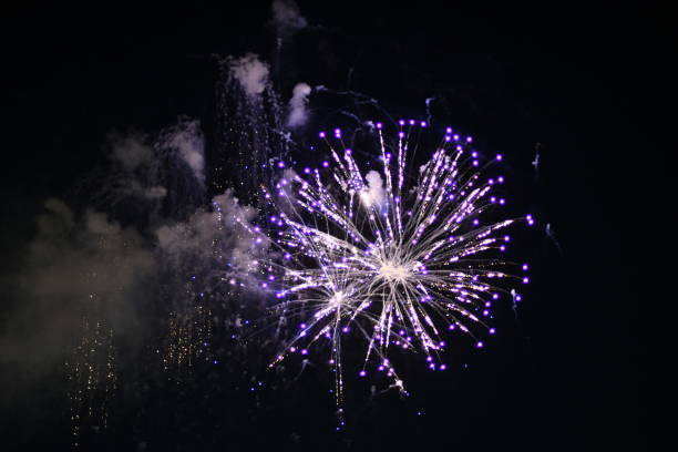 istock Purple and White Fireworks with smoke 1088512922
