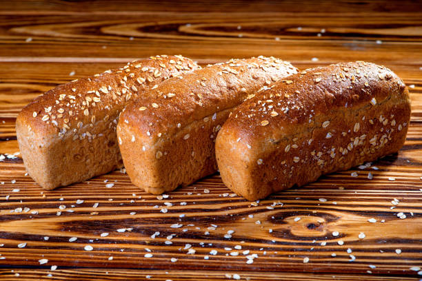 istock Black bread with a crisp and oatmeal on a wooden table. 1088529184