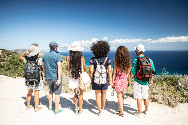 istock Group of backpackers looking at sea 1088537616