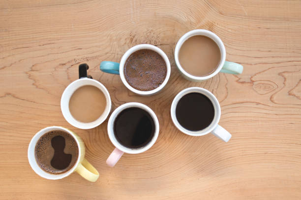 istock Many cups of coffee on wooden table 1088544152