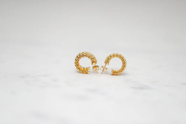 istock yellow gold hoop earrings 1088551442