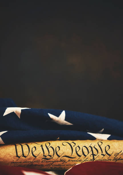 istock United States Constitution with American Flag 1088551496