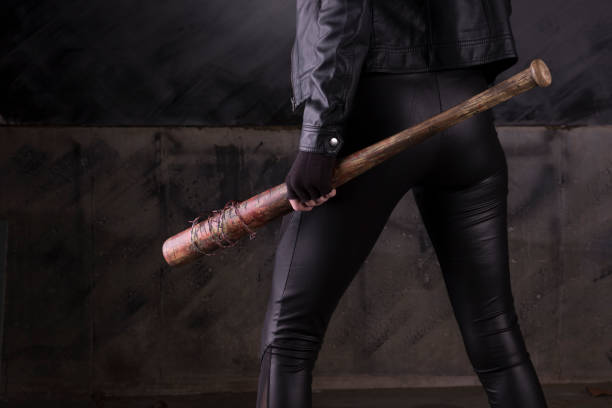 istock Sexy female assassin with a bat 1088551578
