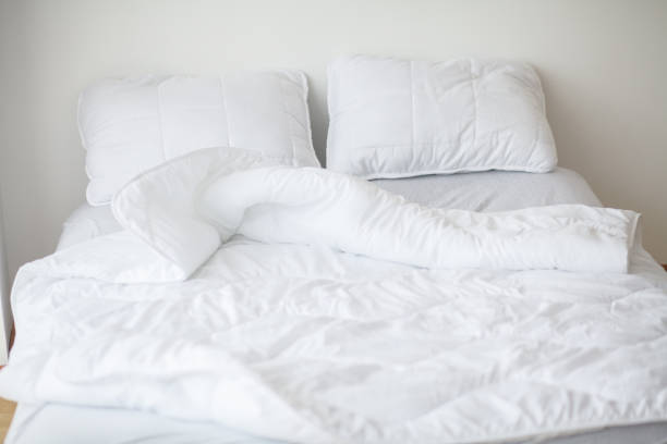 istock Minimalistic interior of white bedroom 1088555720