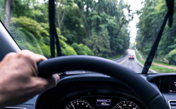 istock Summer Rain Storm Car Driving Driver Perspective 1088558300