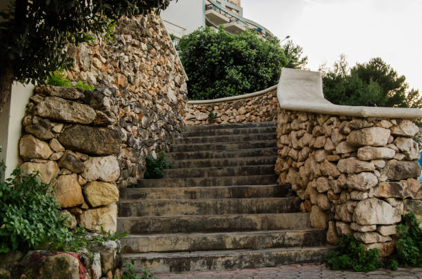 istock Stone stairs in st pauls bay with tree and building in background 1088562600