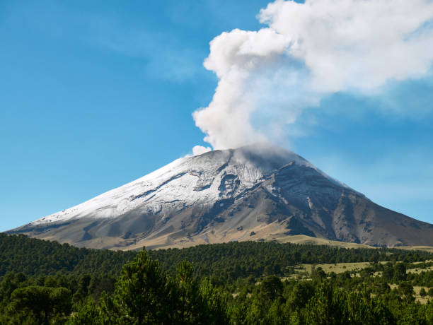 Fumarole comes out from Popocatepetl volcano Fumarole comes out from the crater Popocatepetl volcano seen from Itza-Popo National Park, Mexico popocatepetl volcano photos stock pictures, royalty-free photos & images