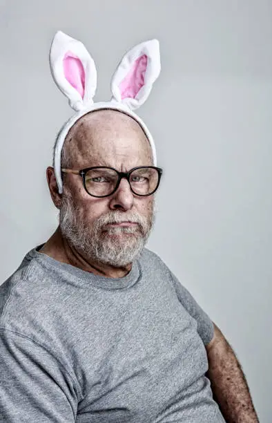 Photo of Pink Easter Bunny Ears Senior Adult Man Cancer Patient Side Effects