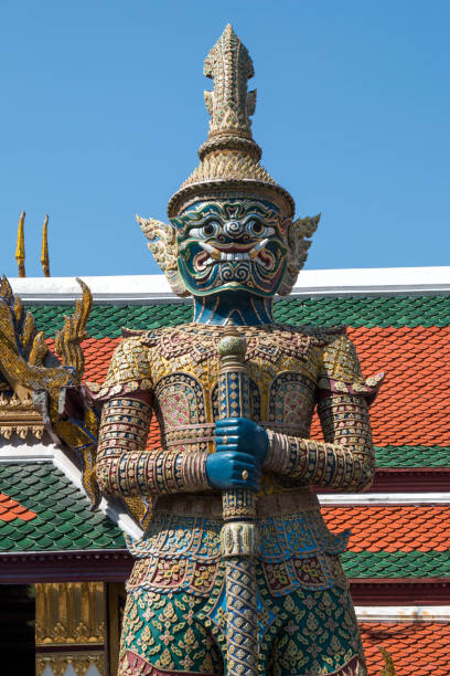 the giant in Temple of the Emerald Buddha (Wat pha kaew) with blue sky. stock photo