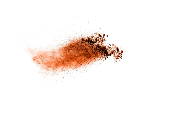 istock Brown particles splattered on white background. Brown dust splashing. 1088578008