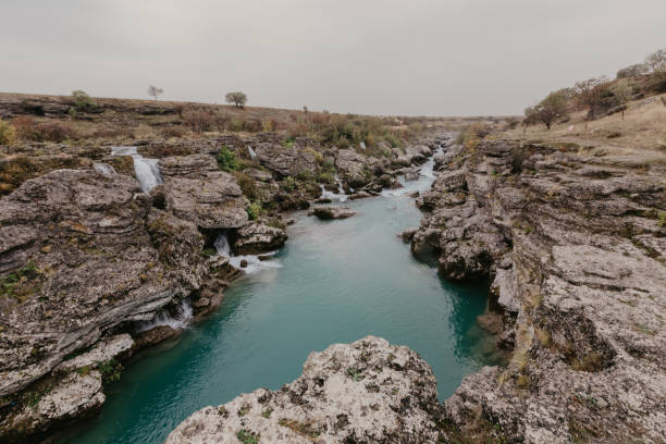 istock Mountain river with huge, big, and small stones and rocks on riverbed 1088599742