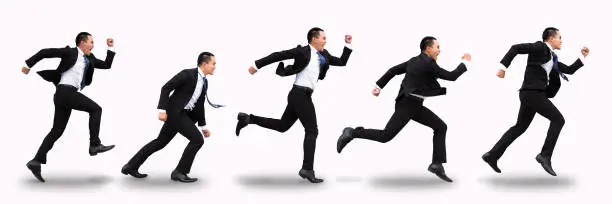 Photo of young business man running and isolated on white