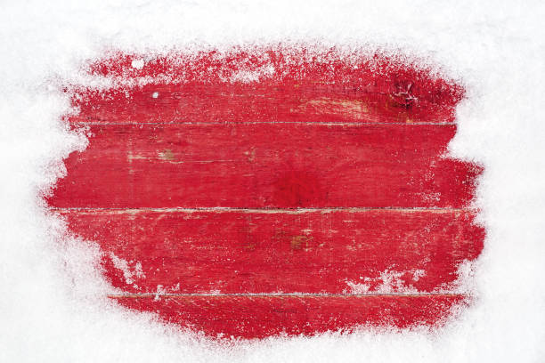istock snow frame on red wooden background 1088618456