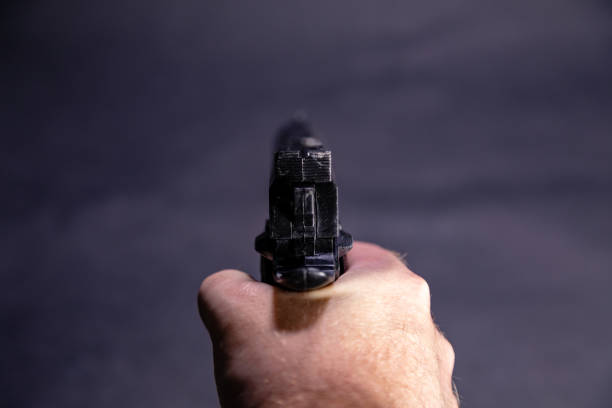 istock POV of hand aiming gun 1088619992