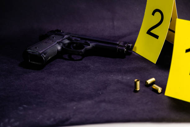 istock Bullets and gun at crime scene 1088619998