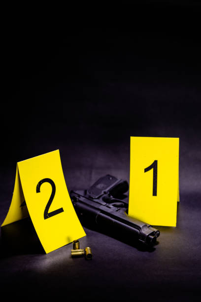 istock Bullets and gun at crime scene 1088620018