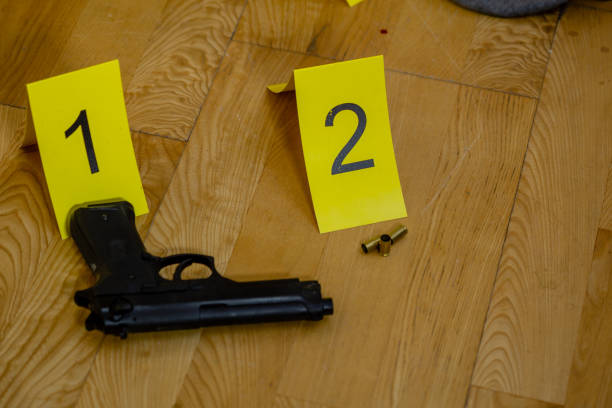 istock Bullets and gun at crime scene 1088620372
