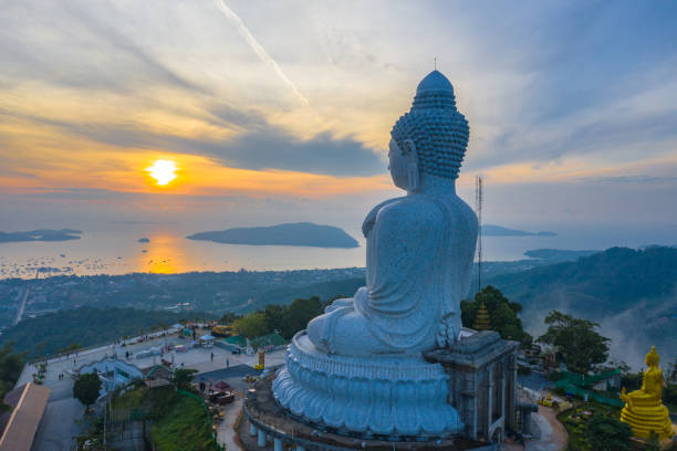 aerial view sunrise in front of Phuket big Buddha aerial view sunrise in front of Phuket big Buddha.Phuket Big Buddha is one of the island most important and revered landmarks on the island. phuket province stock pictures, royalty-free photos & images