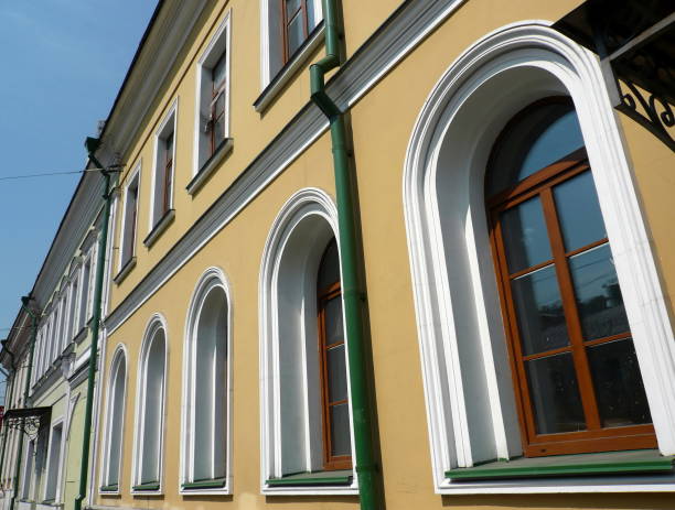 istock old yellow building with green storm-down pipe 1088633820