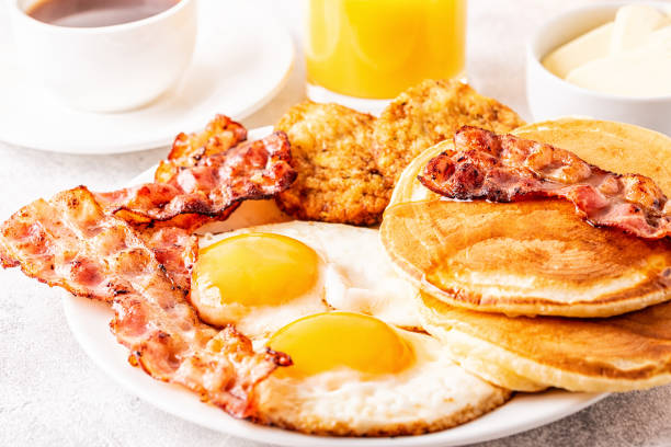 istock Healthy Full American Breakfast with Eggs Bacon Pancakes and Latkes 1088636828