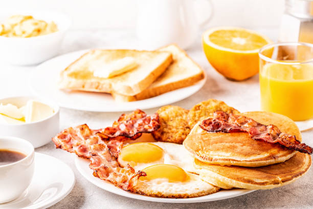 istock Healthy Full American Breakfast with Eggs Bacon Pancakes and Latkes 1088636836