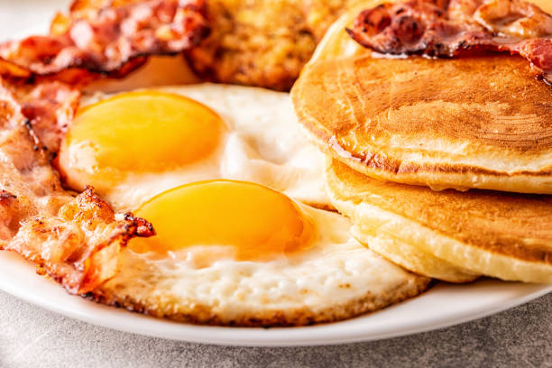 istock Healthy Full American Breakfast with Eggs Bacon Pancakes and Latkes 1088636844