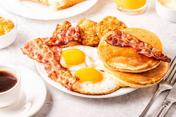 istock Healthy Full American Breakfast with Eggs Bacon Pancakes and Latkes 1088636848
