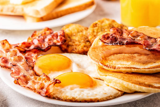 istock Healthy Full American Breakfast with Eggs Bacon Pancakes and Latkes 1088636880