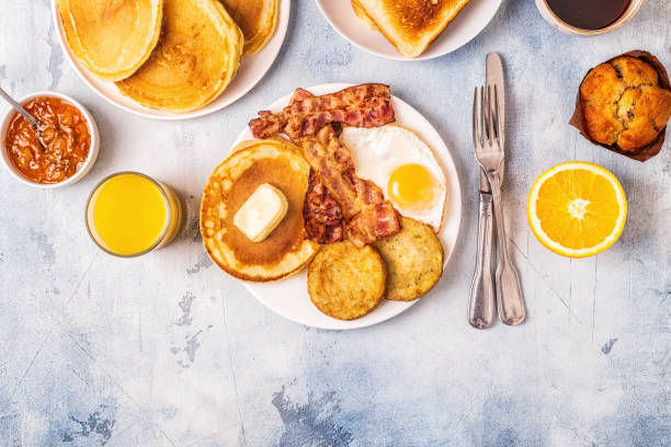 istock Healthy Full American Breakfast with Eggs Bacon Pancakes and Latkes 1088636962