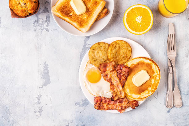 istock Healthy Full American Breakfast with Eggs Bacon Pancakes and Latkes 1088636994