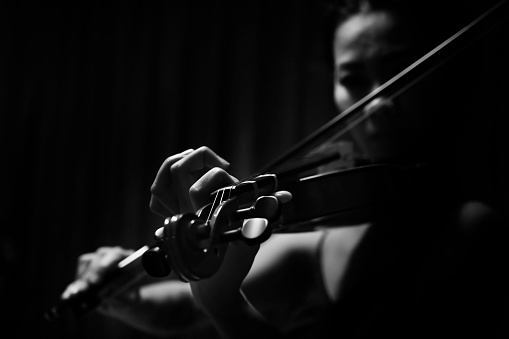 Violinist playing music - monochrome close-up shot