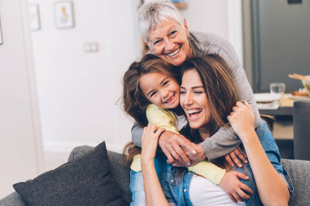 donne di tre generazioni - grandparent senior adult senior women multi generation family foto e immagini stock