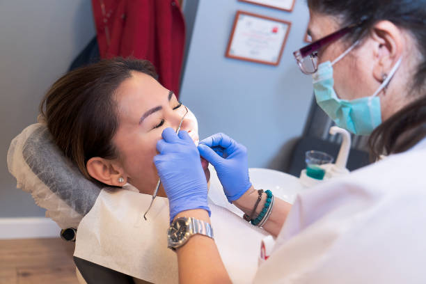 istock Woman having routine dental check-up at dentist clinic 1088640414