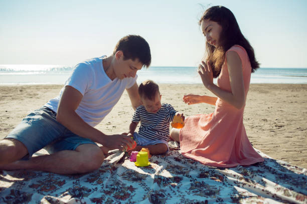 istock Cheerful multi ethnic family have a rest on a sea shore. 1088640924