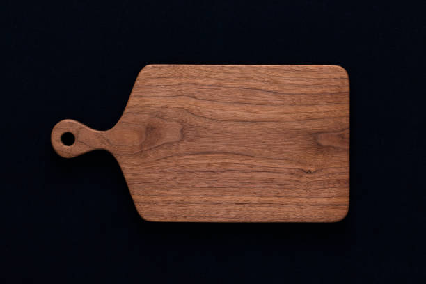 istock Handmade walnut chopping board on black cotton 1088647420