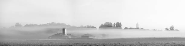 Farm in the fog stock photo