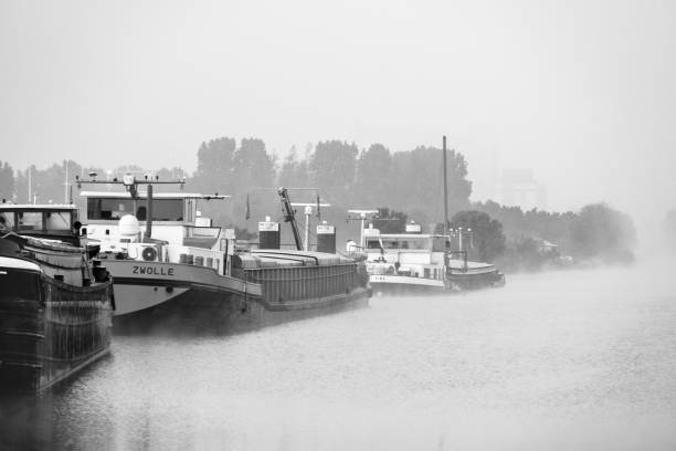 Boats in the fog stock photo