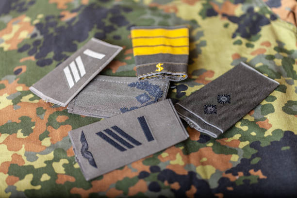 istock german shoulder ranks on a camouflage background 1088649808