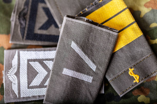 istock german shoulder ranks on a camouflage background 1088649822