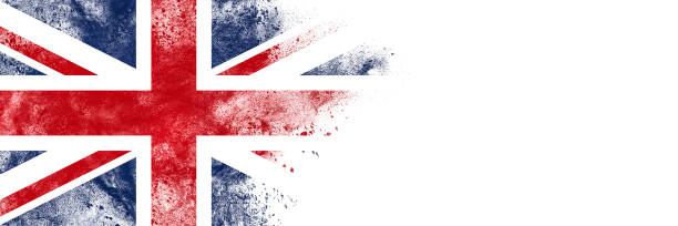 UK Abstract exploding powder in colors of UK flag with lot of copy space on white background. british flag photos stock pictures, royalty-free photos & images
