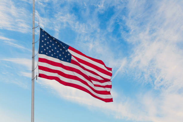 istock American flag on the sunset sky background 1088657806